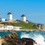 Mykonos Windmills - Turquoise waters, a refreshing sea breeze, and a majestic skyline adorned with the iconic Mykonos Windmills